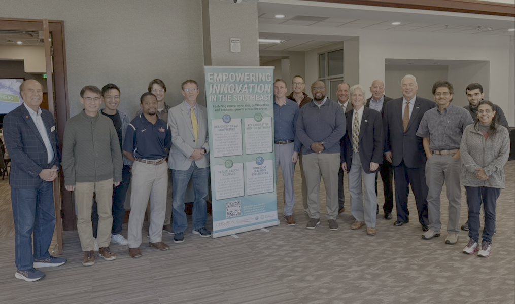 group of people standing beside banner