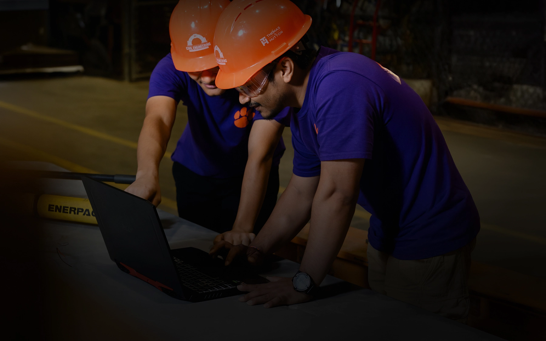 two guys with orange hard hats
